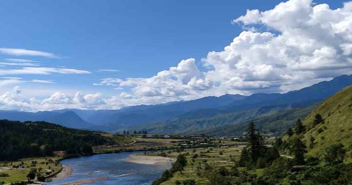 Village is surrounded by snow-capped mountains