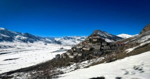 Snow-covered Himalayan village in winter | ALT TEXT: top 10 coldest places in India Himalayan village winter]