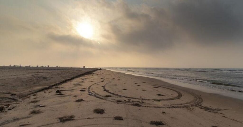 Dark mineral-rich sand at Manginapudi Beach near Machilipatnam