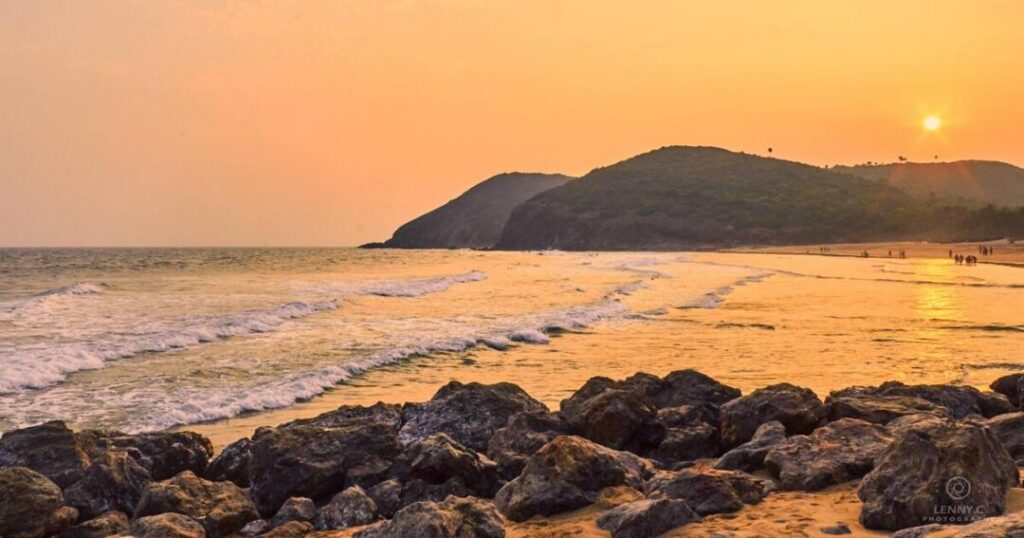 Panoramic view of Yarada Beach surrounded by green hills near Visakhapatnam
